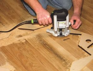 Photo 4: Make at least three to four passes at increasing depths to avoid overheating and damaging the router bit.