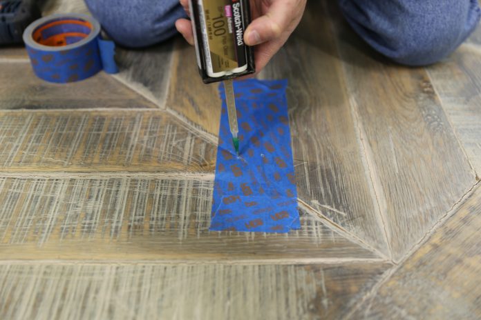 Adding adhesive to hollow spots