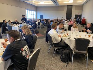 Attendees eating breakfast during The Summit 2024.