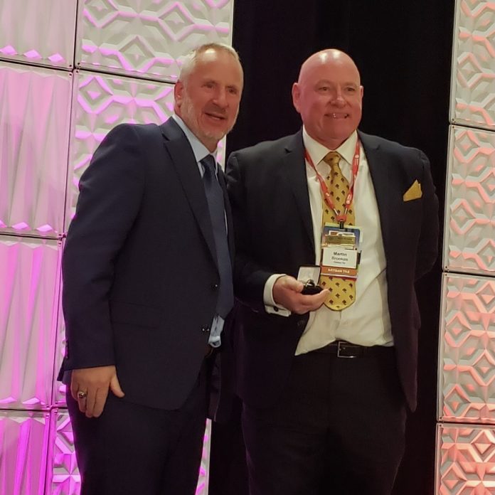 Bart Bettiga with NTCA Ring of Honor recipient Martin Brookes.