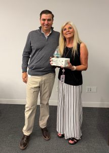 Zack Zehner congratulates Helen Lumpkin on her award.