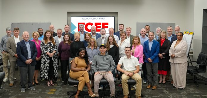 FCEF group photo with logo in background