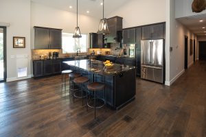 Pacheco R.I.S.E. home kitchen featuring DuChateau wood flooring