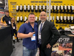 Lee Richards with a customer during TISE 2020